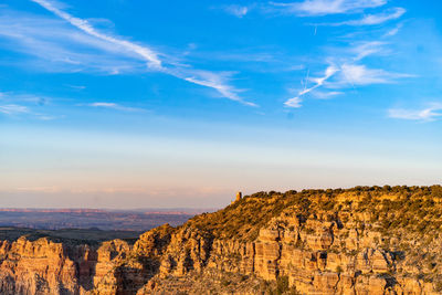 Scenic view of landscape against blue sky