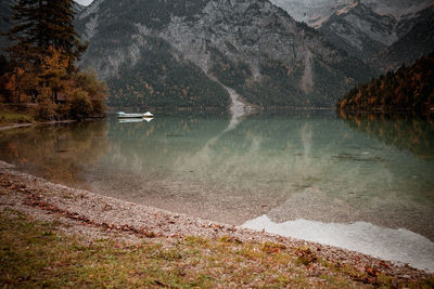 Scenic view of lake in forest during autumn