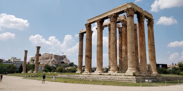 Ruins of historical building against cloudy sky