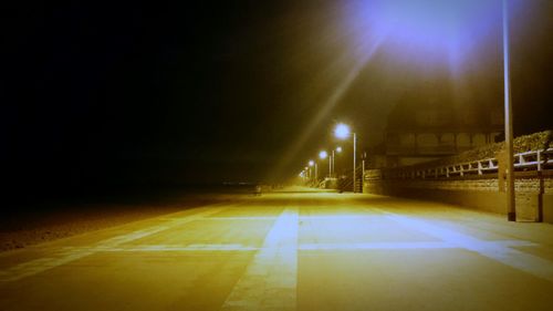 Illuminated road at night