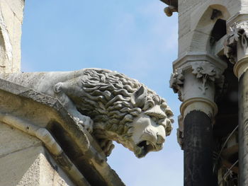 Low angle view of statue against sky