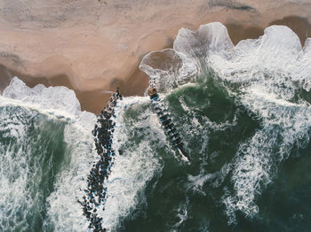 Panoramic view of sea waves splashing on shore
