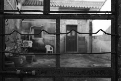 Full frame shot of window with metal railing