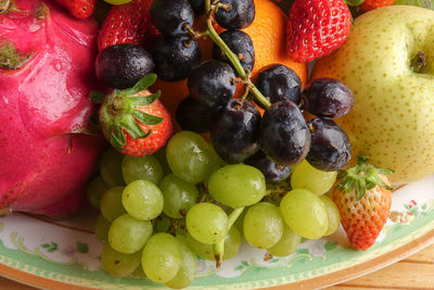 Close-up of grapes in plate