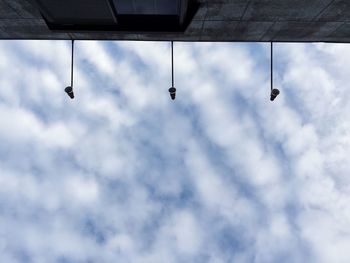 Low angle view of hanging against sky