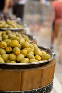Different marinated olives and local food on street market in gdansk, poland. selling and buying