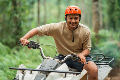 Portrait of man riding bicycle