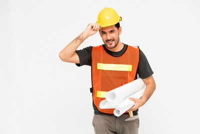 Man working against white background