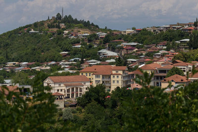 Buildings in town against sky