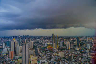 Aerial view of cityscape against sky