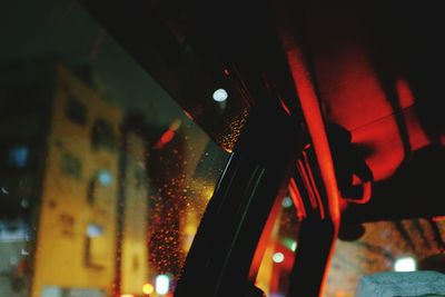 Low angle view of illuminated lights at night