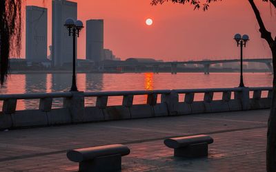 Scenic view of river at sunset