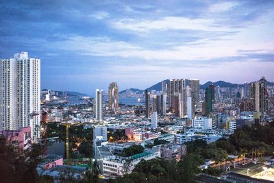 Cityscape against cloudy sky