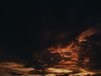 Low angle view of dramatic sky at sunset