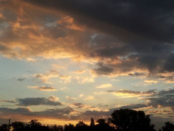 Low angle view of cloudy sky at sunset
