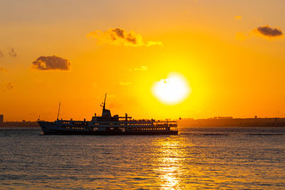 Sunset over the sea and ferry in istanbul