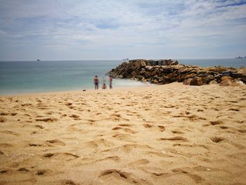 People on beach in angola