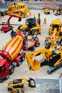 High angle view of yellow construction site on road in city