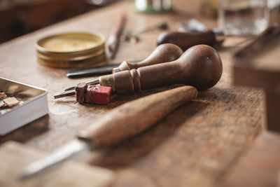 Close-up of work tools on table at workshop