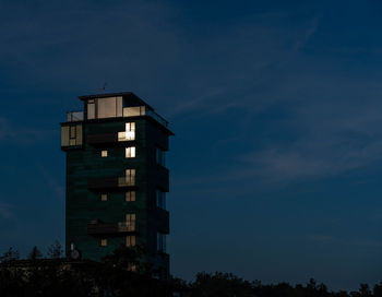 Low angle view of building against sky at night