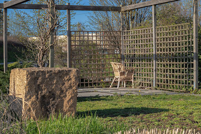 Fence on field against trees