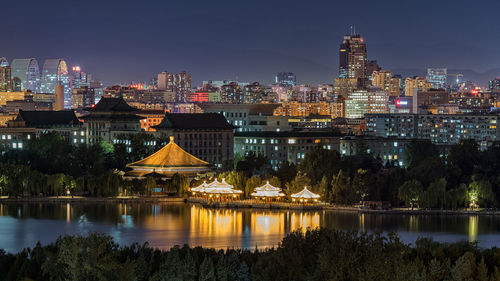 Illuminated buildings in city at night