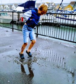 Full length of man in puddle