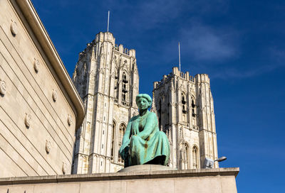 Low angle view of statue against building