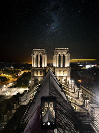 Illuminated building against sky at night