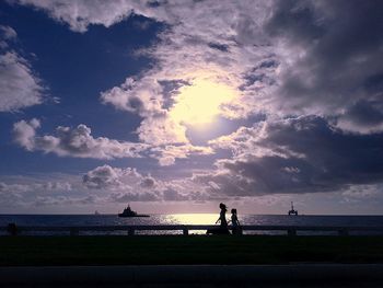 Scenic view of sea against cloudy sky