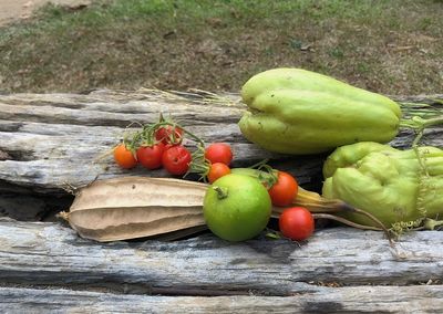 Close-up of apples on wood