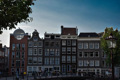 Low angle view of buildings in city against sky