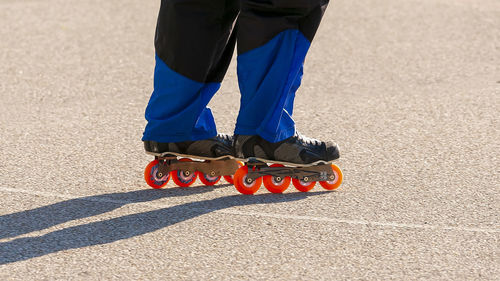 A roller hockey player skating towards the play