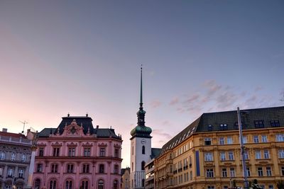 Low angle view of buildings against sky in city