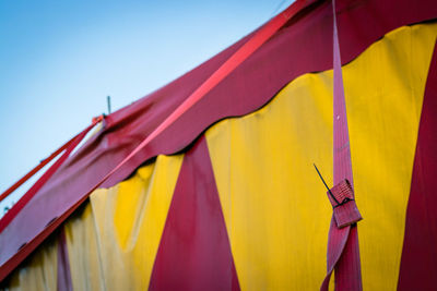 Low angle view of tent against clear blue sky