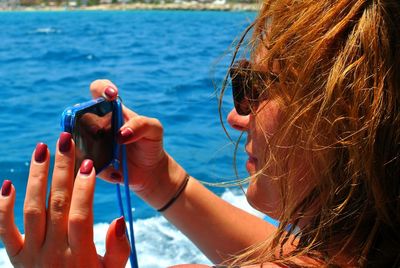 Close-up of woman using mobile phone