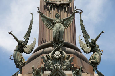 Low angle view of sculpture against sky