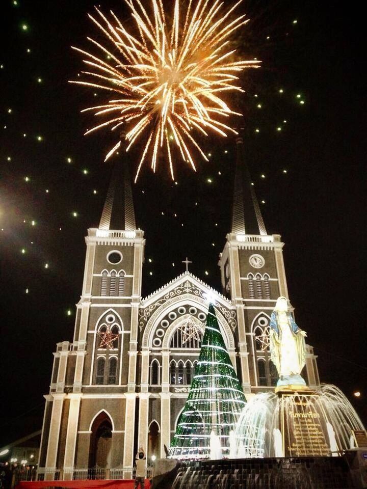 night, illuminated, celebration, low angle view, firework display, religion, building exterior, architecture, built structure, place of worship, arts culture and entertainment, sky, exploding, long exposure, glowing, spirituality, church, firework - man made object, motion