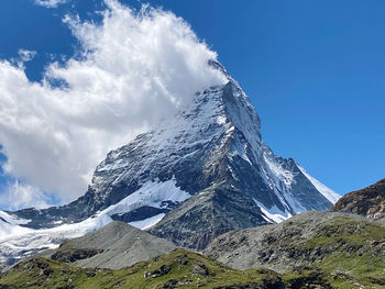 Scenic view of snowcapped mountains against sky