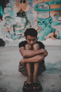 Portrait of shirtless boy sitting