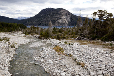 Stream and mountain against sky