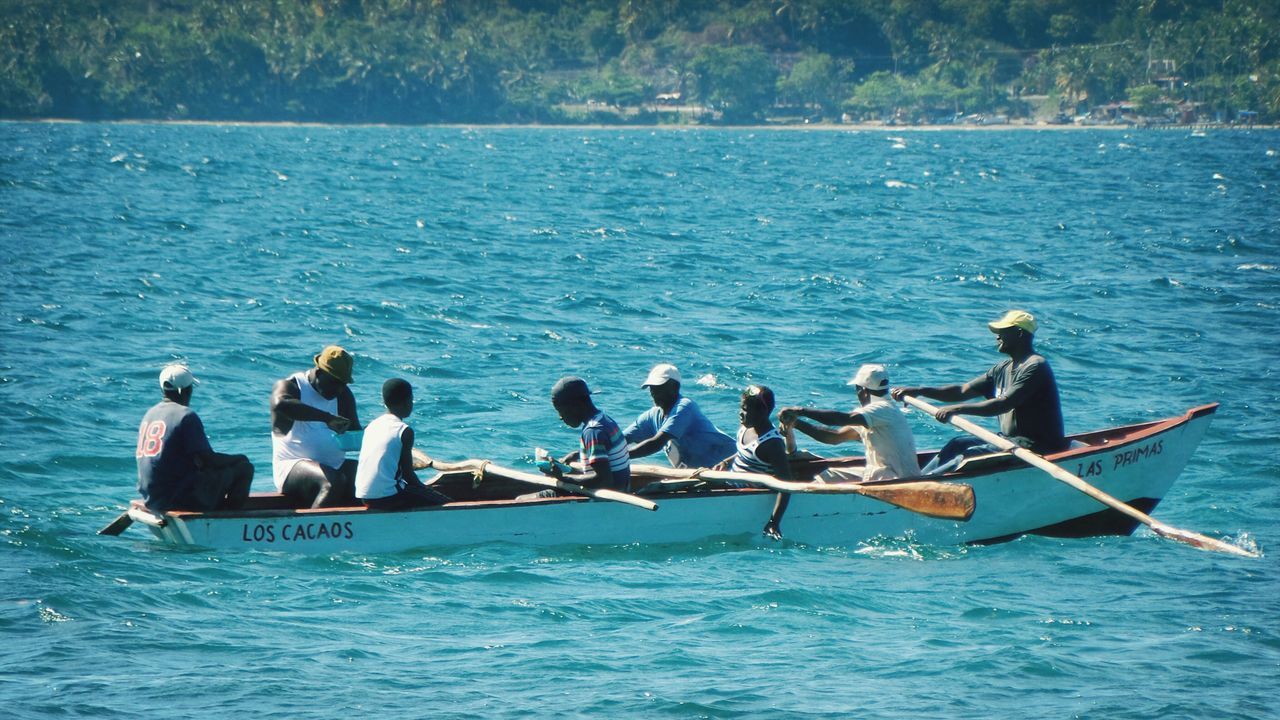 water, nautical vessel, men, sea, leisure activity, lifestyles, transportation, waterfront, boat, vacations, mode of transport, person, large group of people, togetherness, enjoyment, rippled, nature, medium group of people, sitting