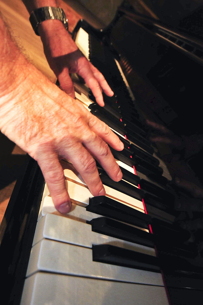 MAN PLAYING PIANO