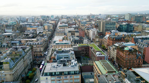 High angle view of buildings in city against sky