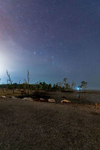 Scenic view of field against sky at night