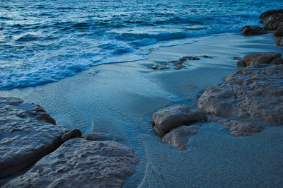 High angle view of rocks at sea shore