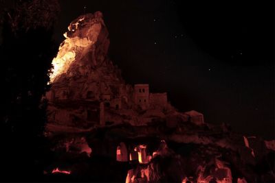 Low angle view of illuminated building at night