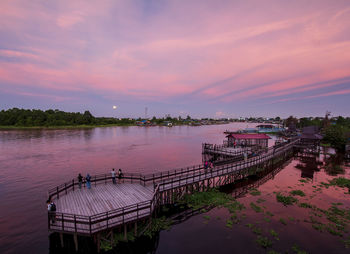 Scenic view of river against sky during sunset