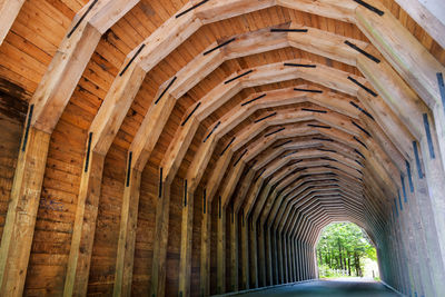 Low angle view of wooden arch tunnel