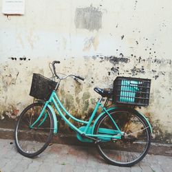 Bicycle parked against wall